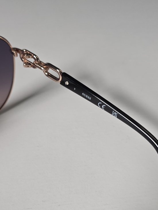 GUESS Rose Gold Frame Sunglasses with Purple Lenses